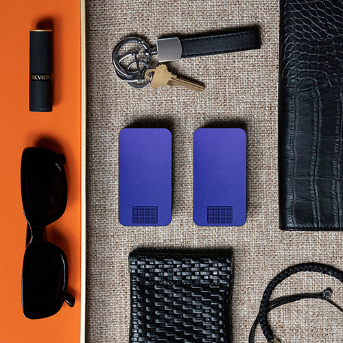 Red product box labeled 'IKIGAI CASES' with an orange case inside on a marble surface.