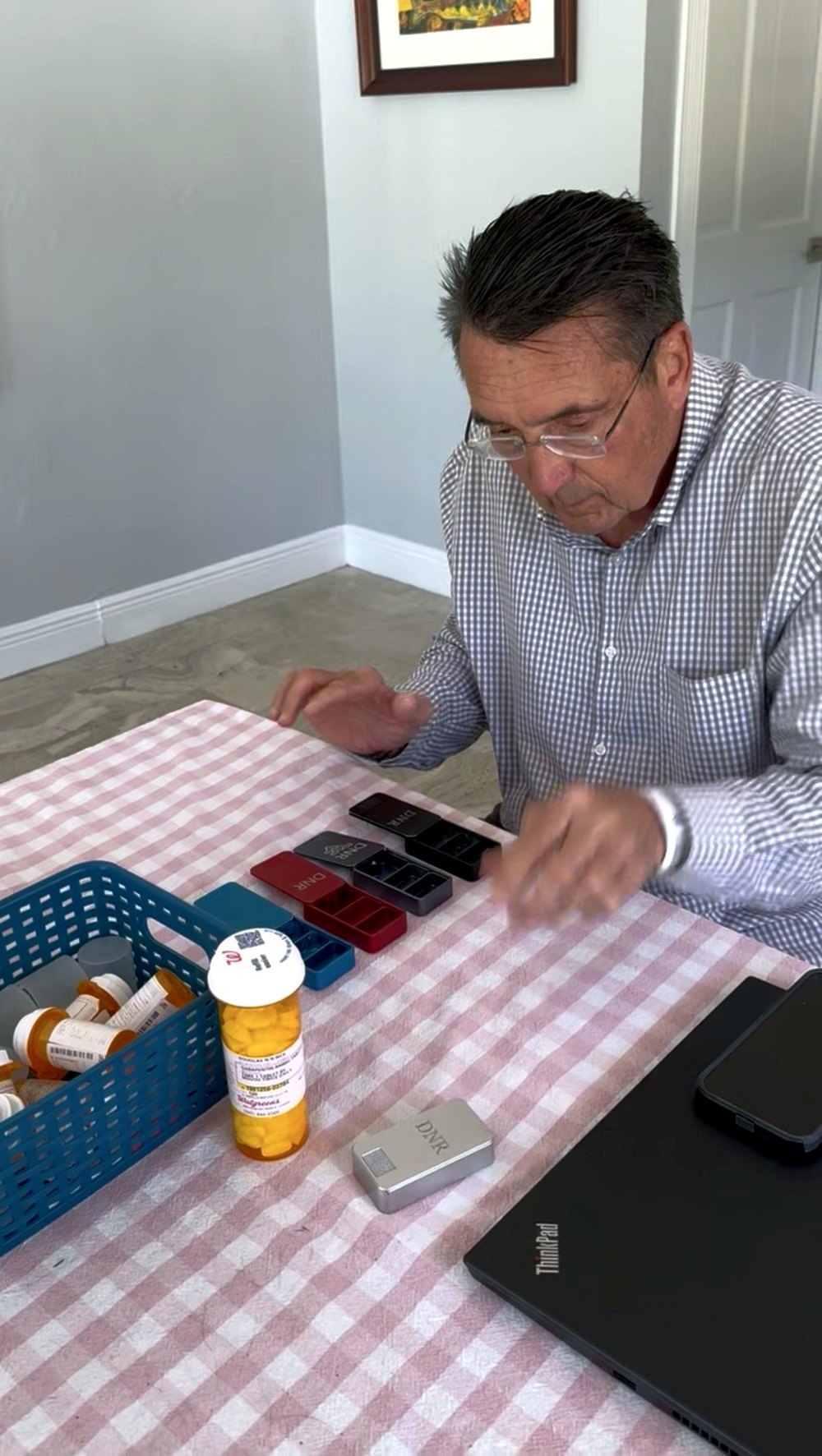 Dad at the table filling his engraved Ikigai cases in five colors