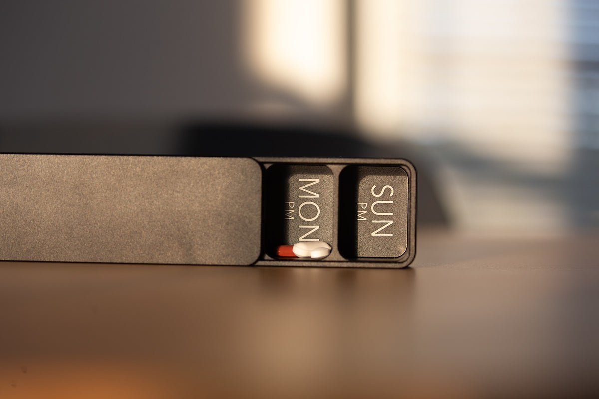 Ikigai AM/PM case slid open in evening window light