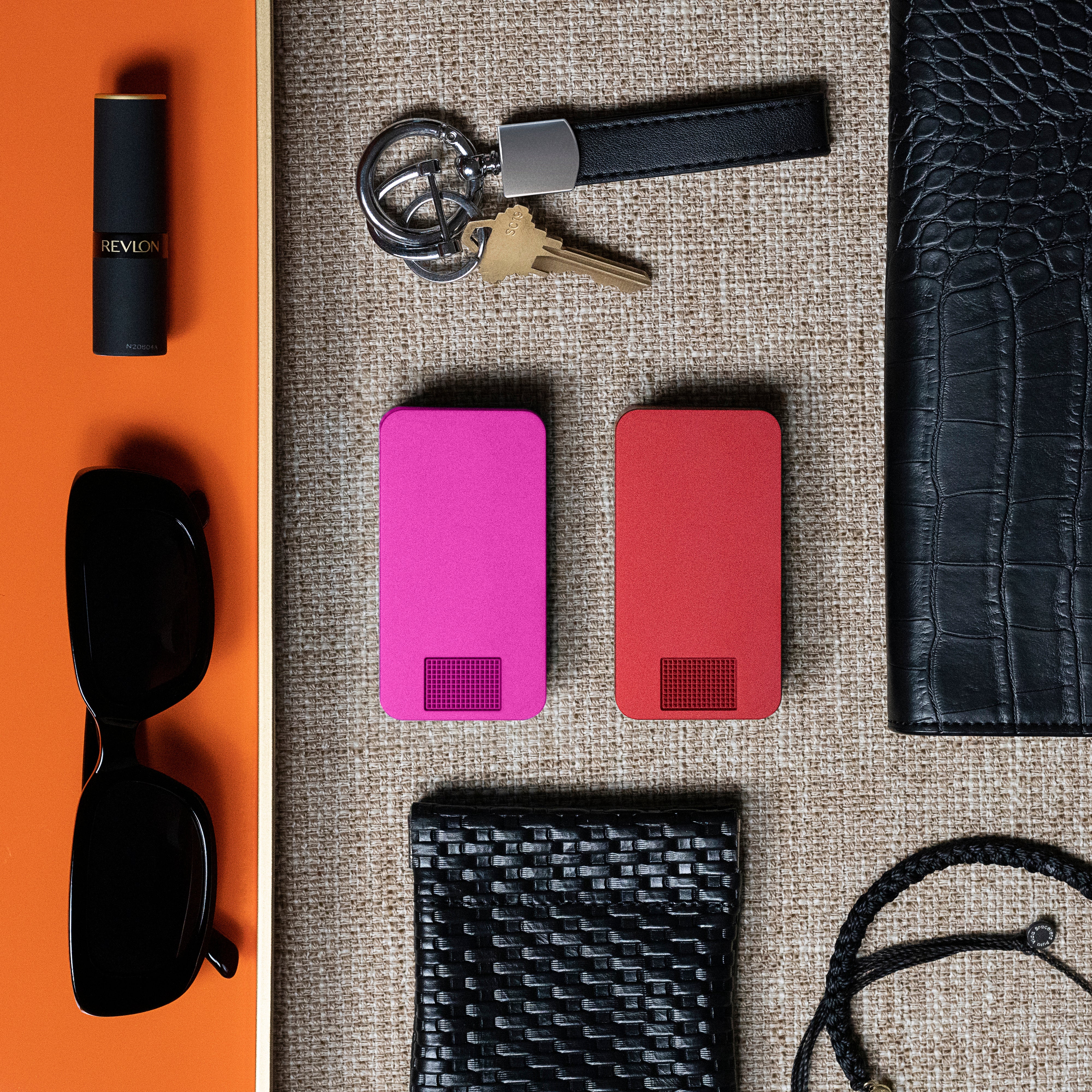 Red product box labeled 'IKIGAI CASES' with an orange case inside on a marble surface.